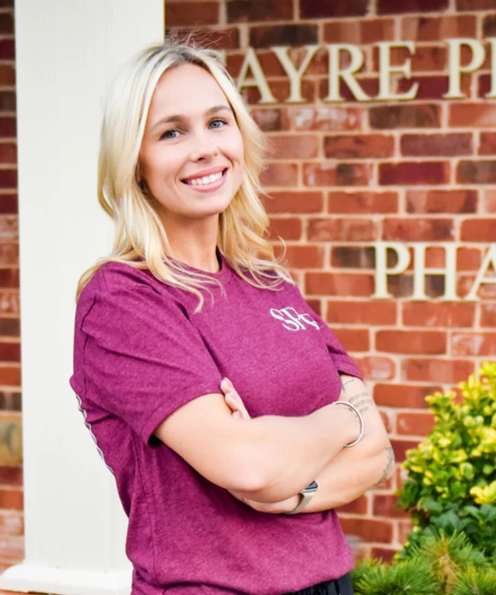 Amber Cottom outside Sayre Professional Pharmacy.