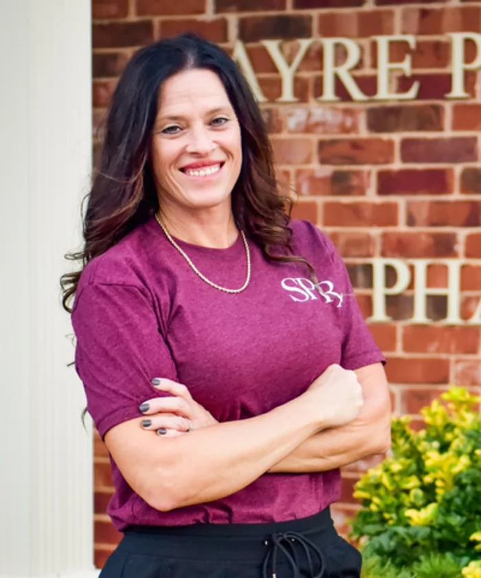 Nikki Jennings outside Sayre Professional Pharmacy.